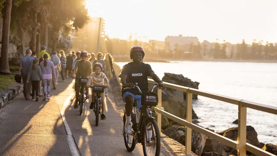 Breathtaking Manly Beach Bicycle and Sunset Cruise Tour - The sunset return through Sydney Harbour
